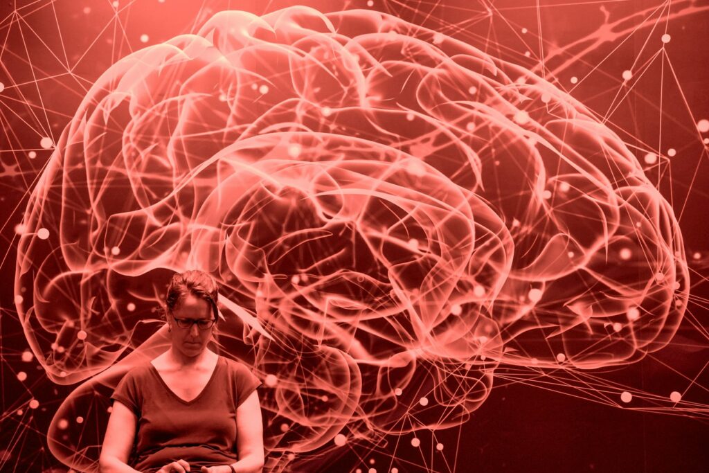 Abstract red brain network with a person